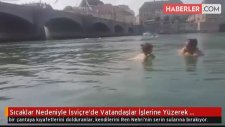 İsviçre'de Sıcaklar Nedeniyle İşe Yüzerek Giden Çalışanlar